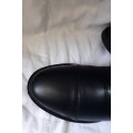 Bottes en simili-cuir noires